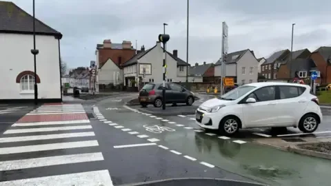 Traffic lights at a busy roundabout