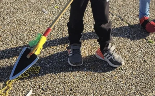 End throwing of bamboo arrows in Lafayette Parish parades