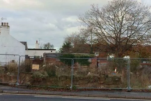 Smarten up site on corner of High Street, Gresford.