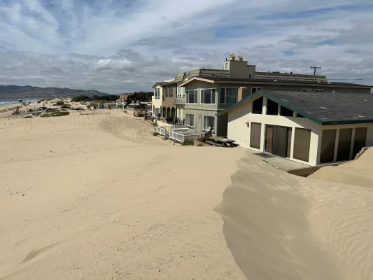Strand Way Owners Seeking Help with Dangerous Sand Pile-Up!