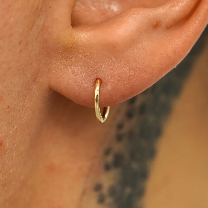 Ear ring ban, on p e and swimming lessons in schools.