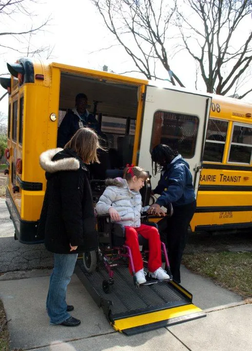Mandatory bus phones and aides for special needs children