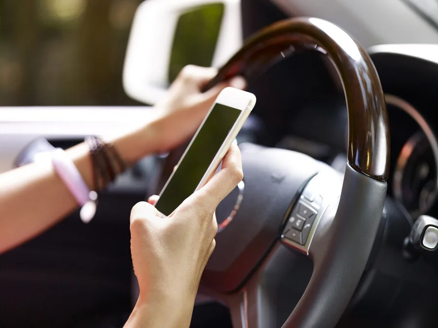 BAN  CELL  PHONES  AND  TEXTING  WHILE  DRIVING