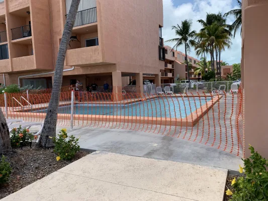 Orange construction fence removal