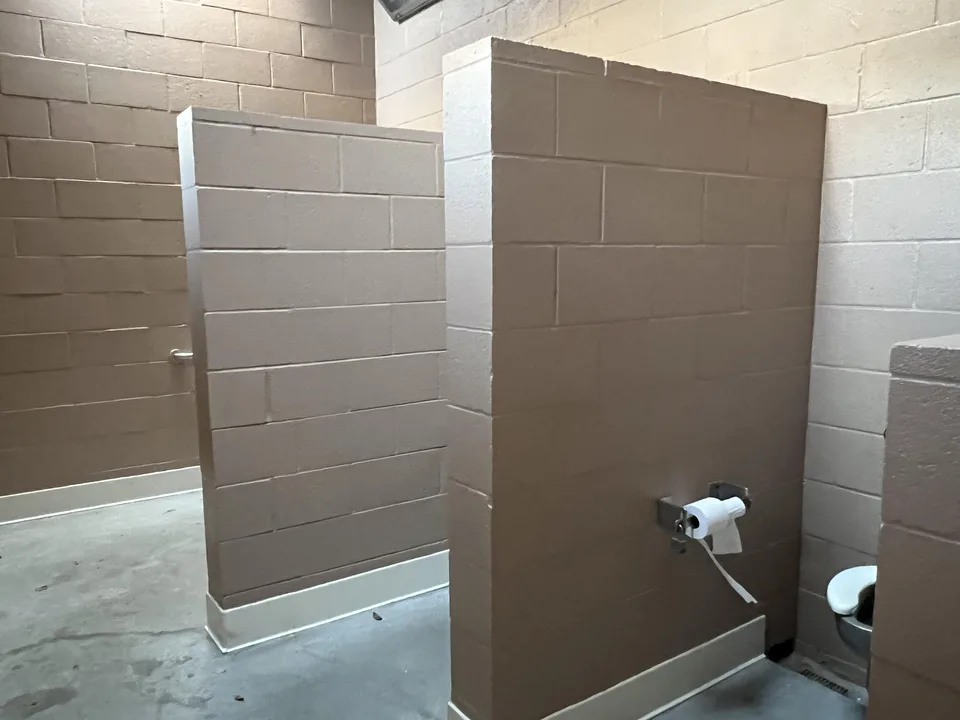 we want stall doors at the nitro city park bathrooms
