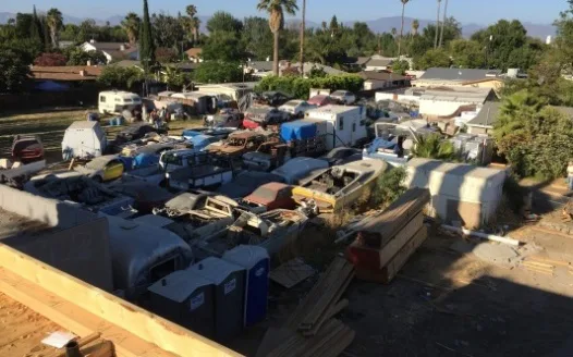 End Hazardous Illegal Junkyard on Residential Property